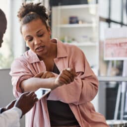 Woman showing her doctor her skin rash