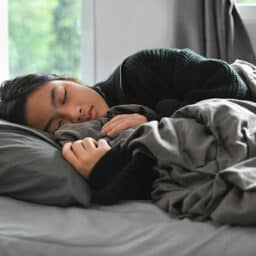 Young woman sleeping in her bed.